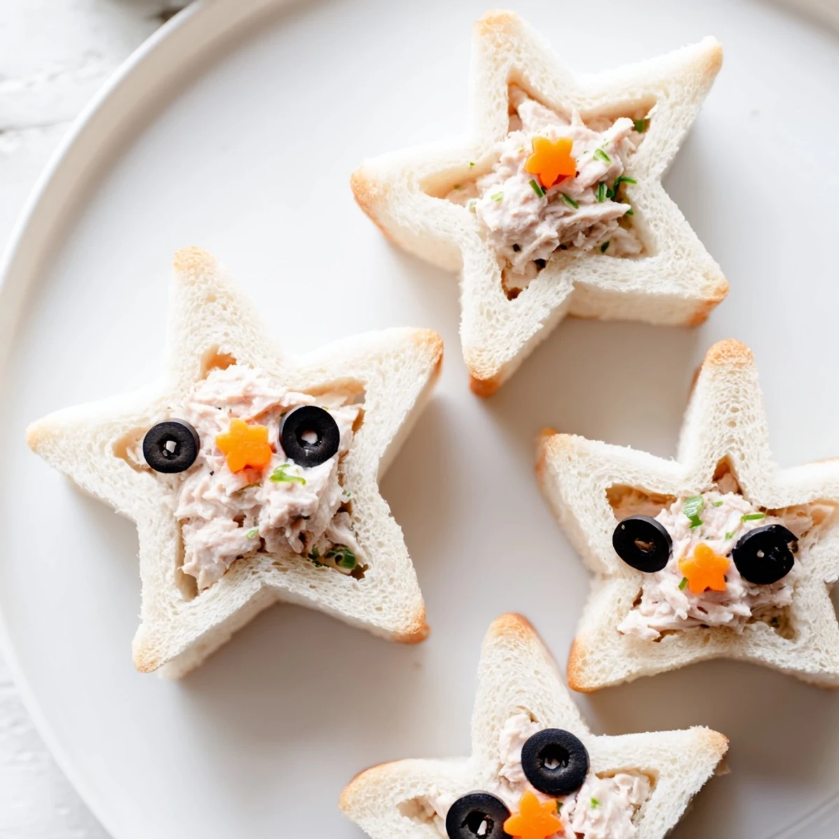 Easy to make kid-friendly Mini Starfish Sandwiches with tuna, perfect for parties or lunchboxes.