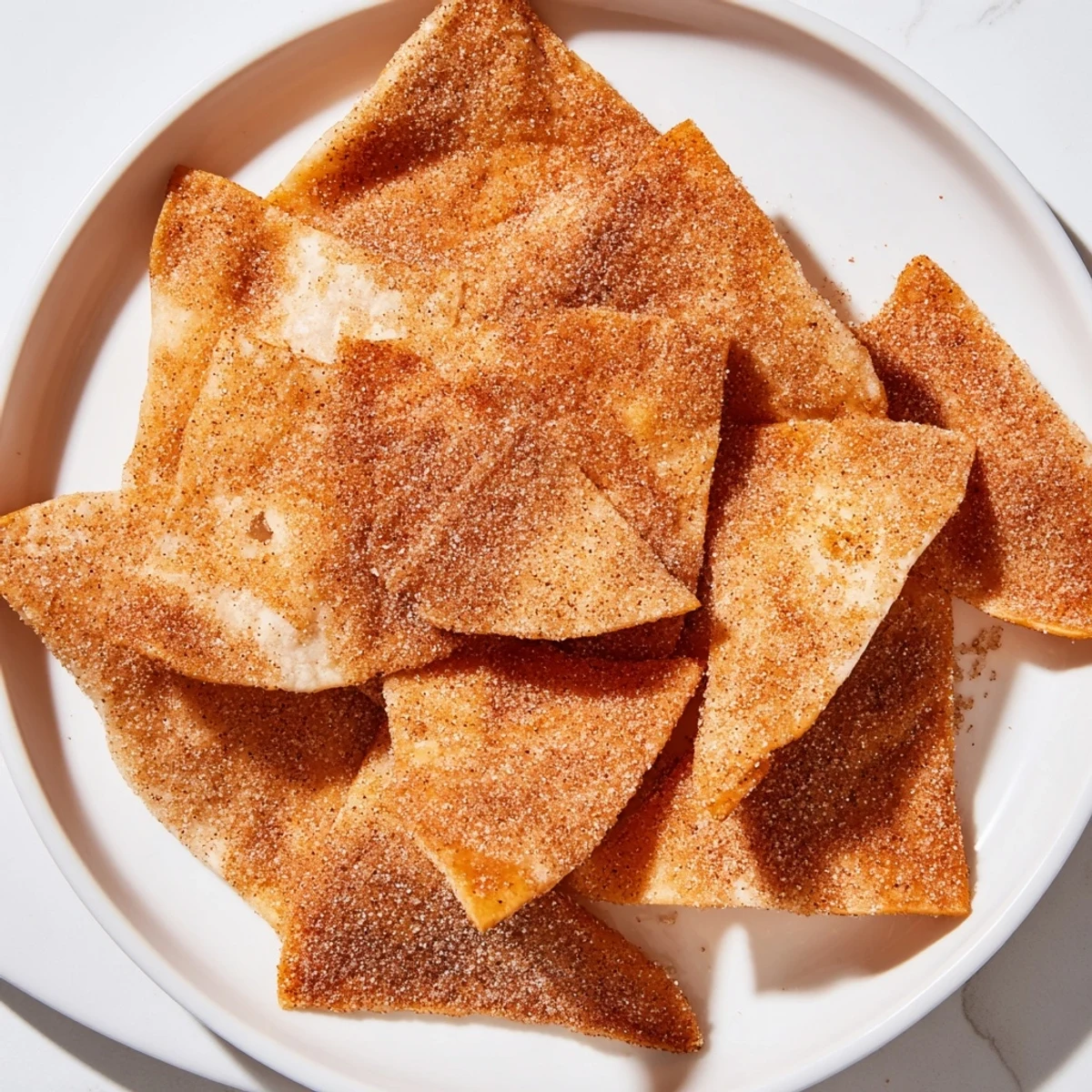 Golden, crispy cinnamon sugar tortilla chips, a simple sweet snack, perfect for sharing.