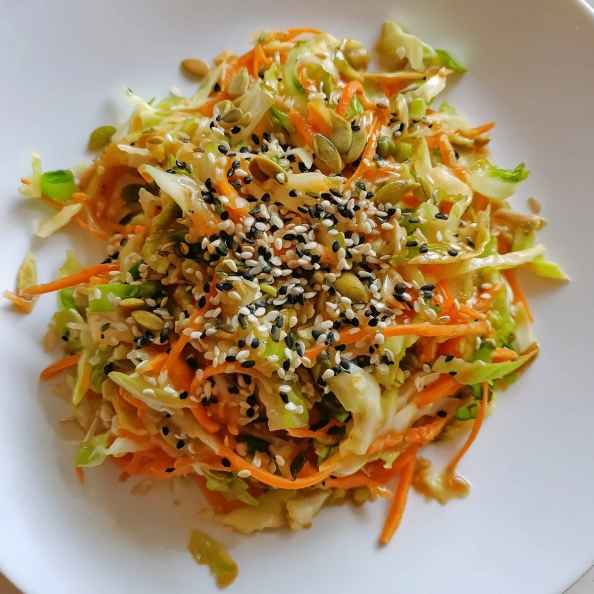 Crisp Cabbage-Core Slaw Salad, bursting with vibrant veggies and nutty sesame dressing, ready to enjoy.