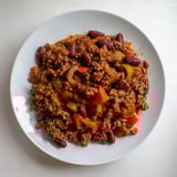 The dark, rich colors of this slow cooker beef & shallot chili suggest a hearty, flavorful meal.