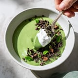 Close-up of a layered Grinch Green Mint Matcha Chia Pudding, topped with berries and chocolate chips.