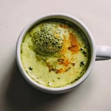 Close-up of a frothy, warm Coconut Ginger Matcha Winter Immunity Latte, perfect for a cold day.