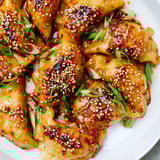 Crispy air fryer frozen dumplings glistening with sesame oil, a quick and delicious Asian-inspired snack.