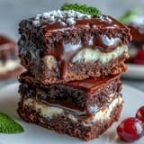 A colorful dessert bar with mini lemon cheesecake cups, fudgy brownie bites, and fresh berry tartlets, perfect for sharing at a housewarming party.  