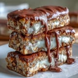 Buttery cookie bars made with clotted cream and studded with white chocolate, perfect for tea time or dessert platters.