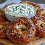 High-protein bagels topped with everything seasoning, served with creamy Greek yogurt everything dip for a savory breakfast or snack.