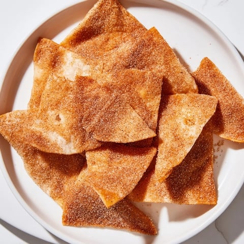 Golden, crispy cinnamon sugar tortilla chips, a simple sweet snack, perfect for sharing.