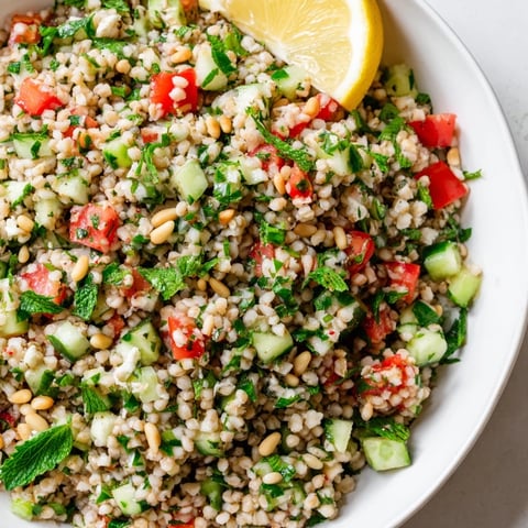 A colorful Tabbouleh Grain Bowl, brimming with fresh ingredients and a bright lemon dressing.