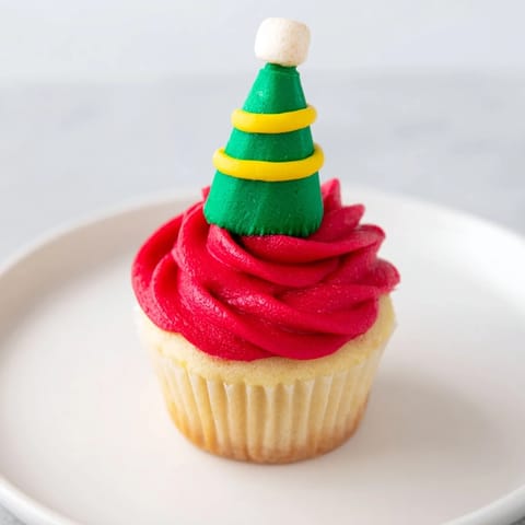 Festive Elf Hat Cupcake Tower, with colorful buttercream and sugar cone hats, ready to serve.