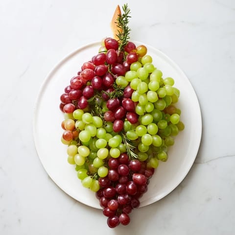 Artfully arranged Vineyard Grape Cluster centerpiece, featuring plump grapes, ready to be enjoyed.