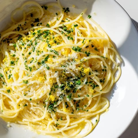 Close-up of freshly made Lemon Capellini with herbs, a light and flavorful Italian pasta dish.