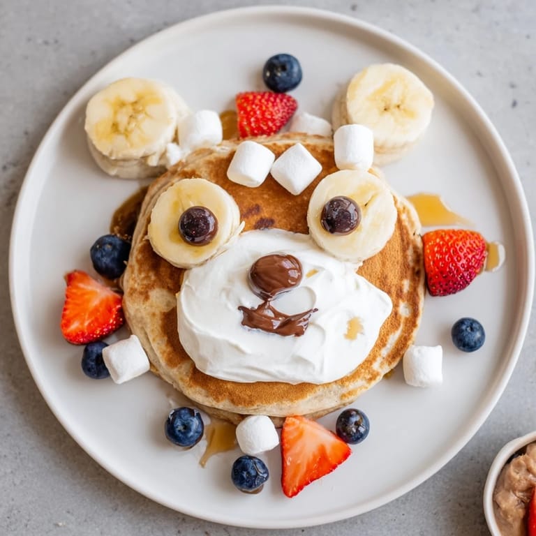 Delightful Polar Bear Pancakes, decorated to resemble bears, are served on a large brunch board.