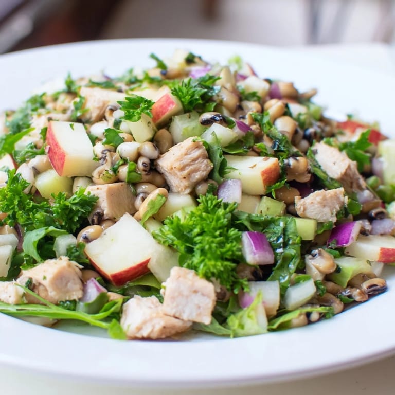 This delicious image of Chicken and Apple New Years Luck Salad shows a vibrant and refreshing salad ready to eat.