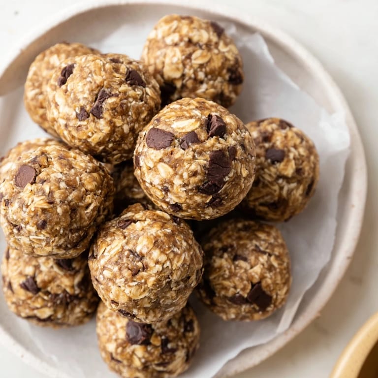 Banana Chocolate Chip Energy Balls stored in a clear jar, perfect for quick on-the-go snacking.