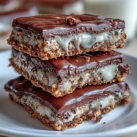 Decadent clotted cream cookie bars with white chocolate, golden brown and loaded with creamy chunks for a rich dessert.